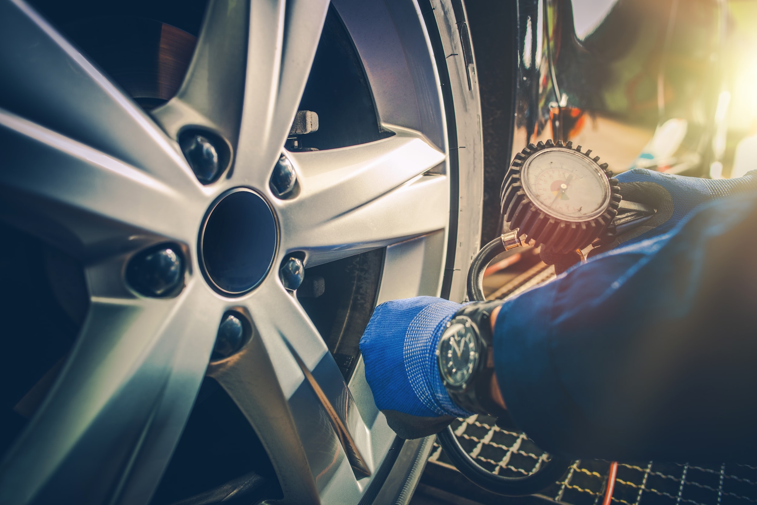 Mechanic Checking Tire Pressure