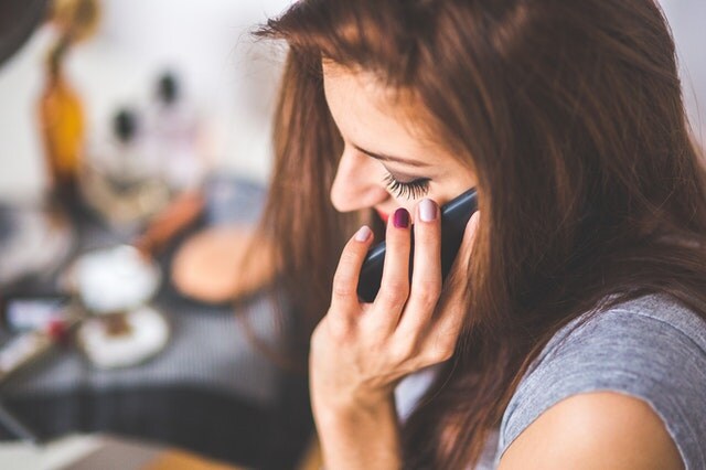 closeup portrait of young lady talking on mobile phone closeup portrait of young lady talking on mobile phone