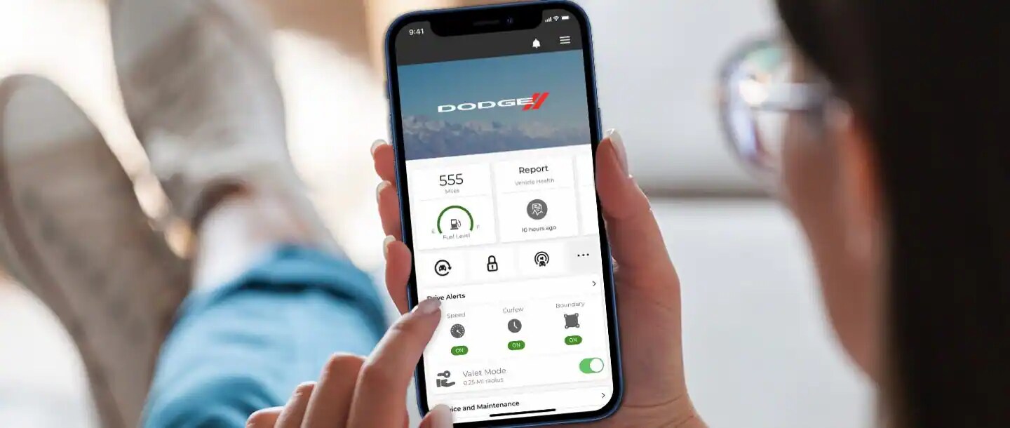 Dodge vehicle with Uconnect® system An image showcasing the Dodge Uconnect app