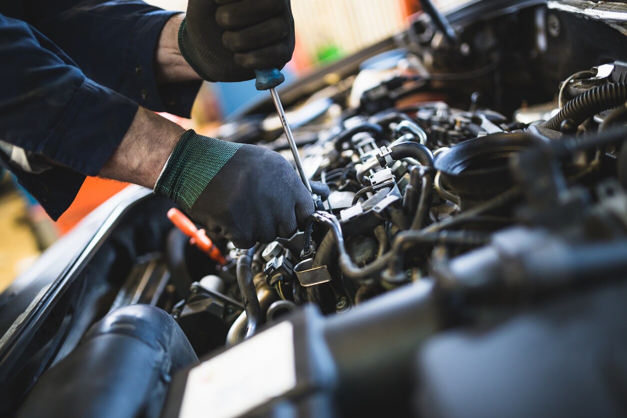 Technician working on vehicle