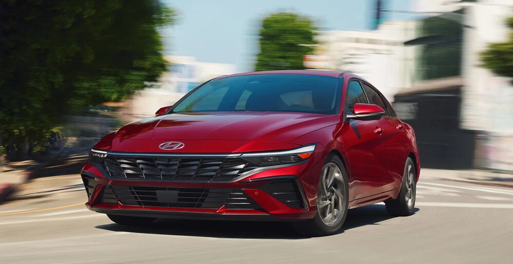 2024-hyundai-elantra-research-center.jpg 2024 Hyundai Elantra driving down the road