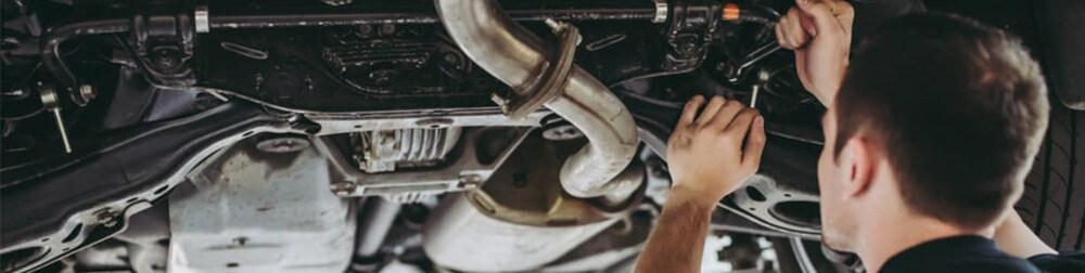 Picture of underside of car during a wheel alignment