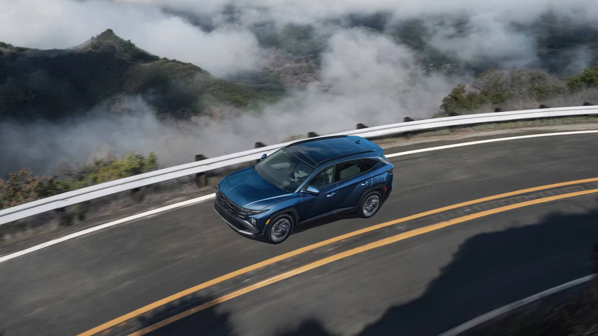 2025 Hyundai Tucson driving around a corner