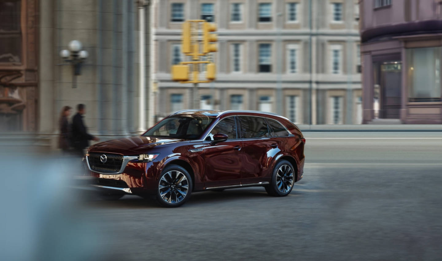 2025 Mazda CX-90 driving through the city
