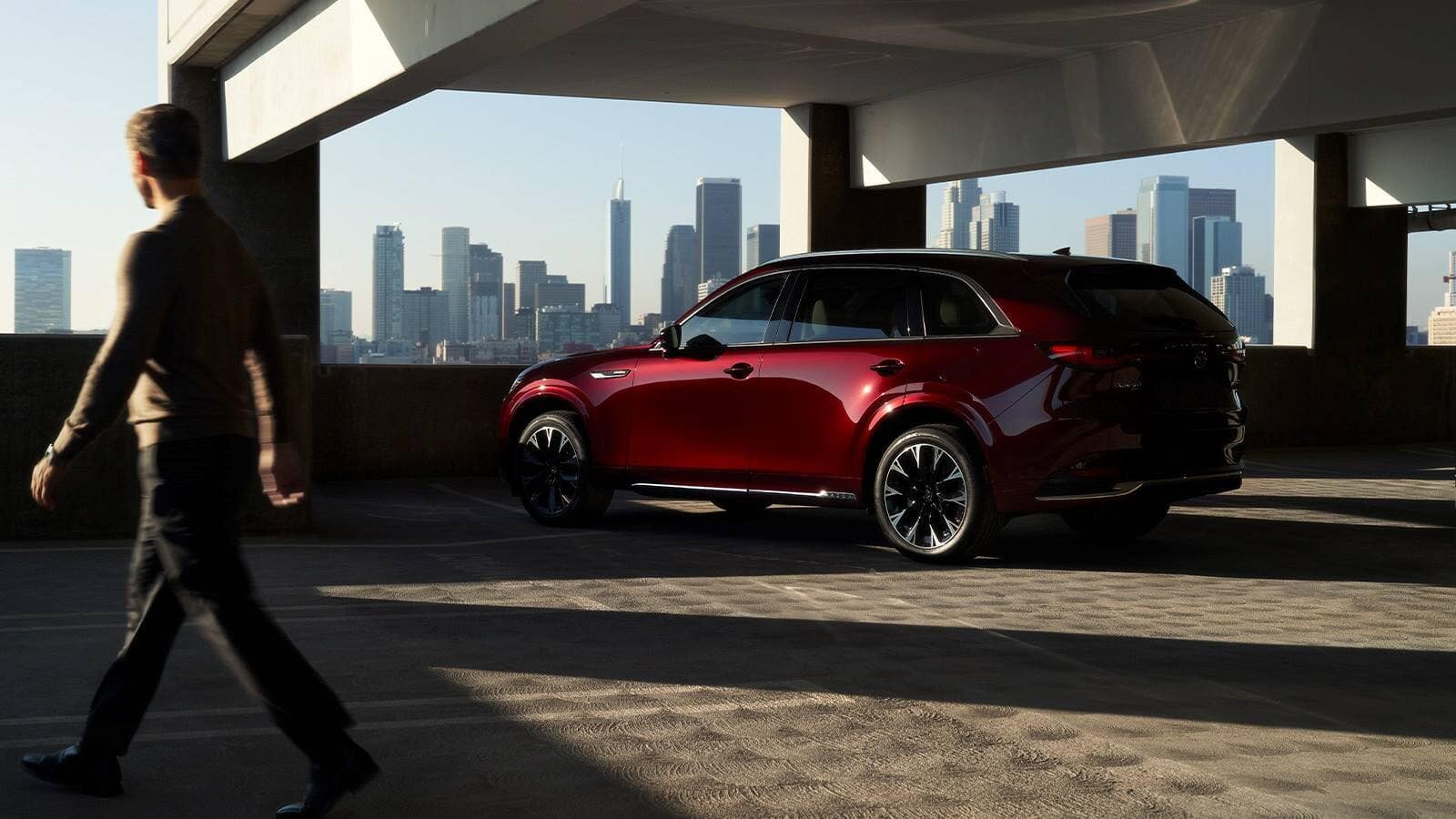 Mazda CX-90-man.jpg 2024 Mazda CX-90 with man walking by