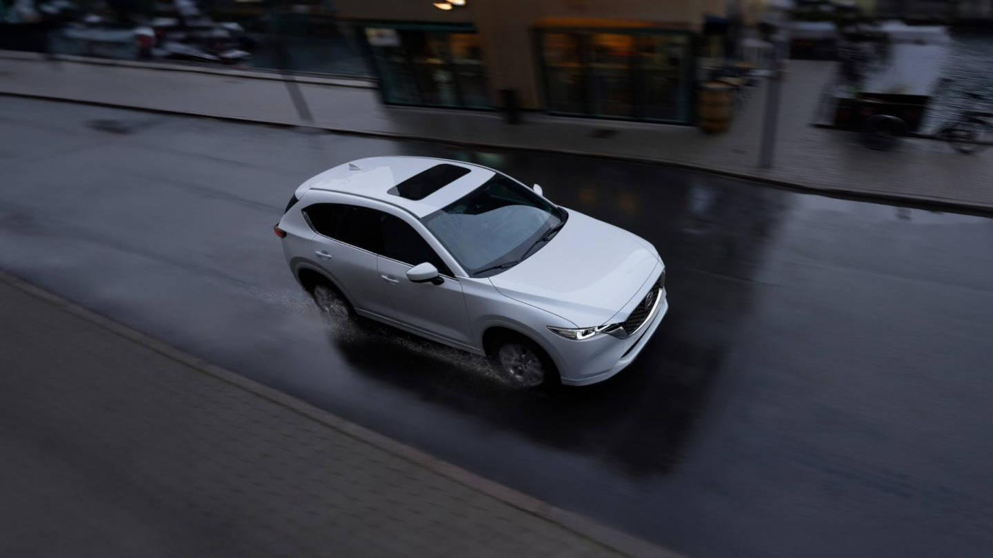 2025 Mazda CX-5 driving through the city