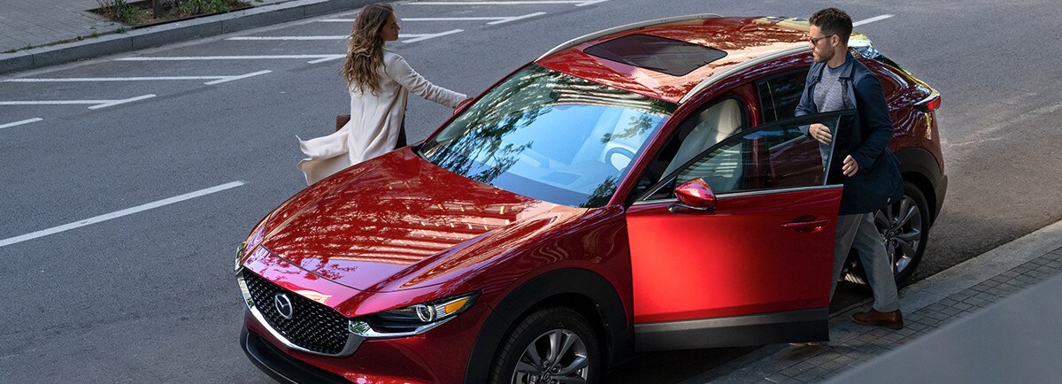 2024-CX-30-mazada-financing.jpg 2024 CX-30 Parked with couple getting out