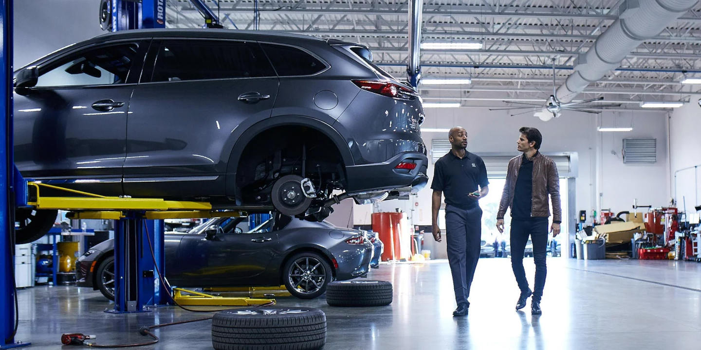 Mazda-Service.jpg Mazda mechanic discussing suspension work with a customer