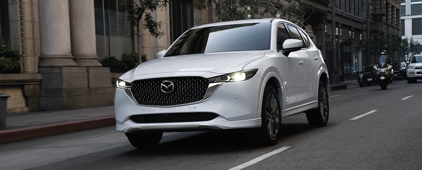 Mazda Mazda CX-5.jpg 2024 Mazda CX-5 driving down the road