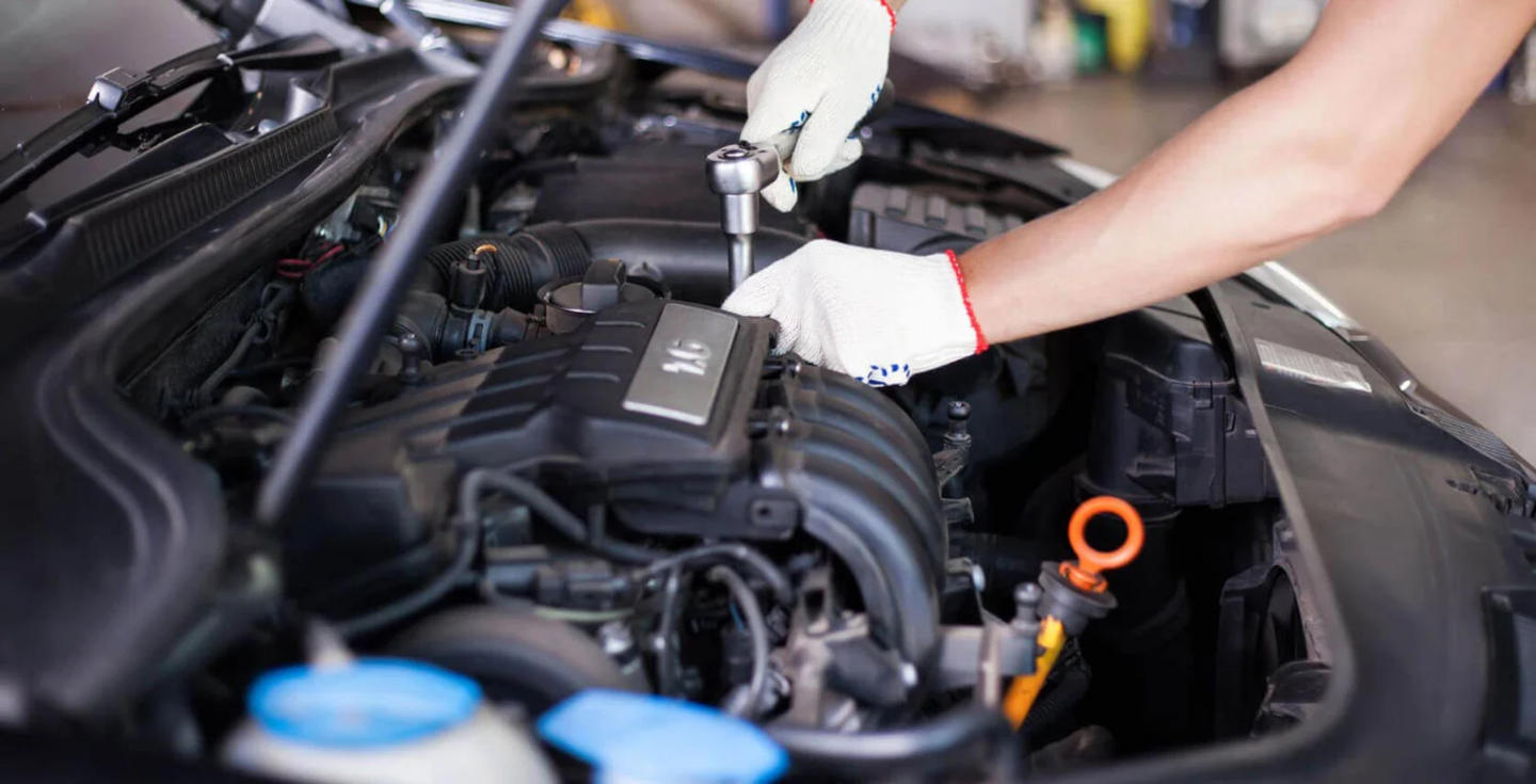 Mazda mechanic doing engine work