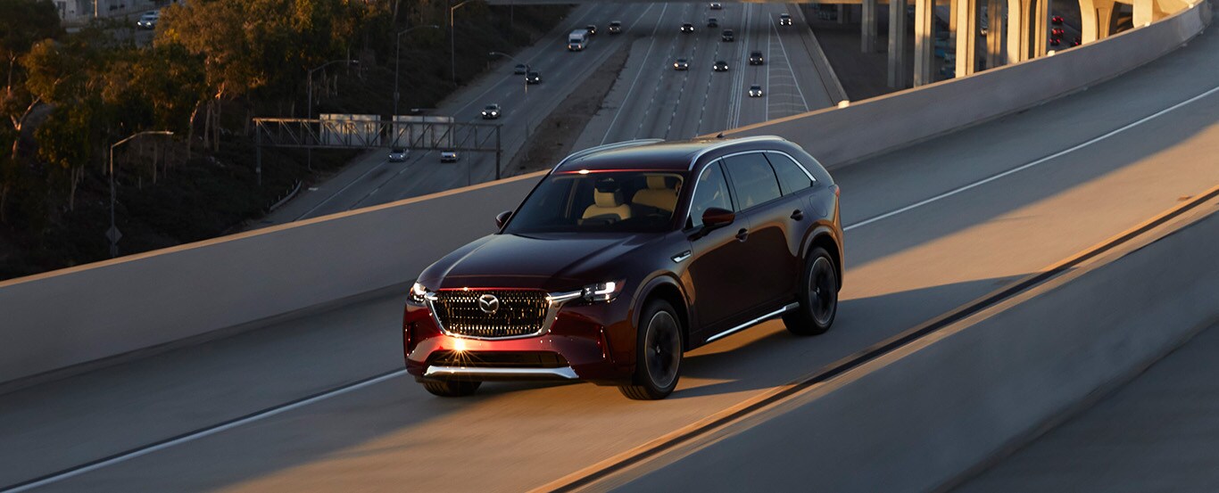 Mazda CX-90.jpg 2024 Mazda CX-90 driving on an off ramp