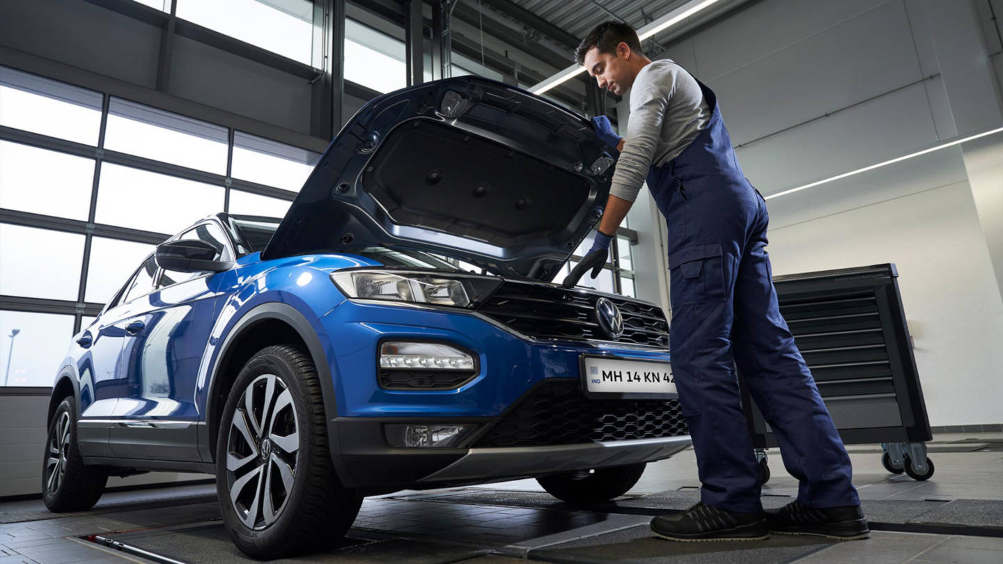 Mechanic servicing a Volkswagen