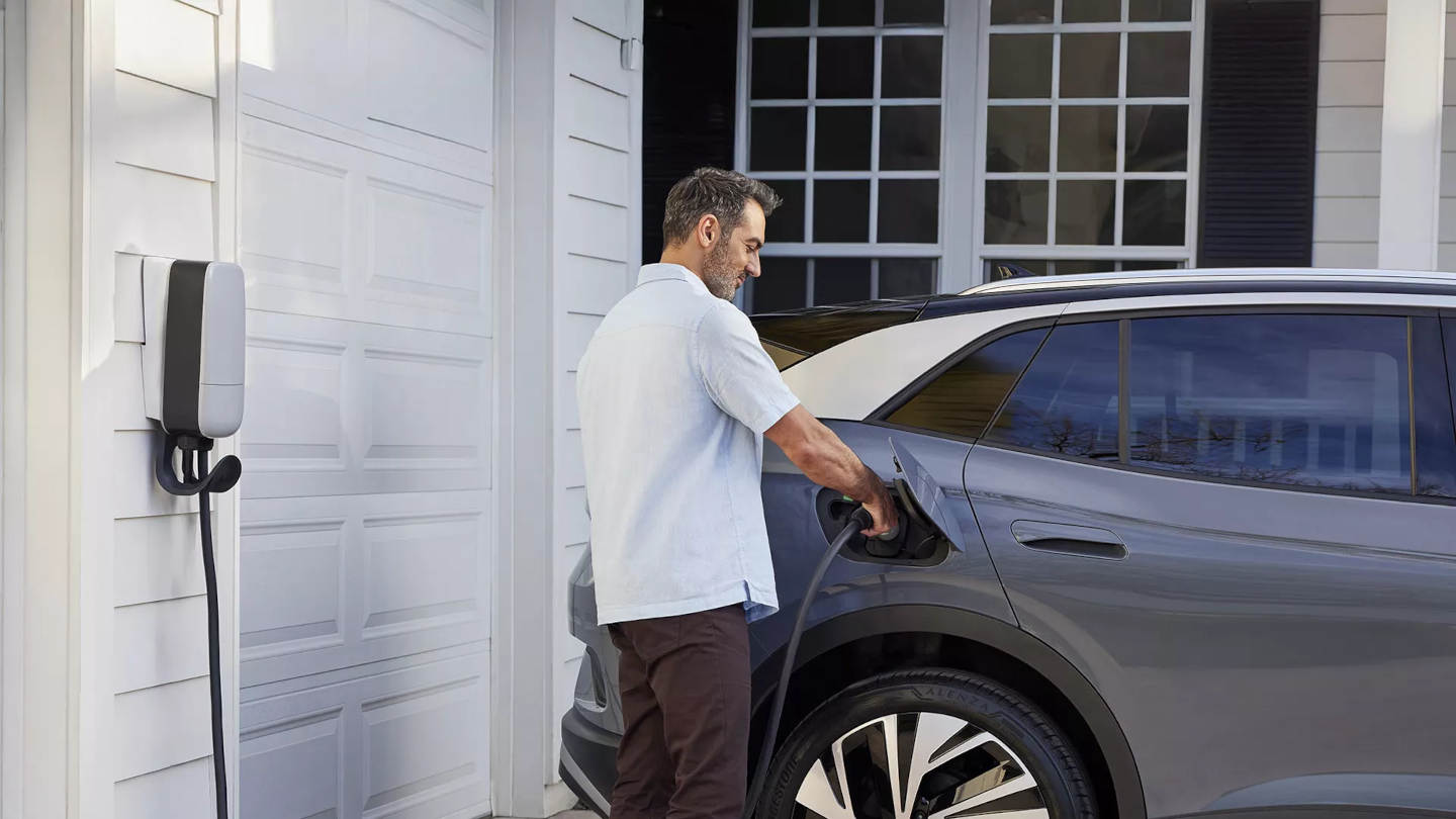 Man charging a 2025 Volkswagen ID.4