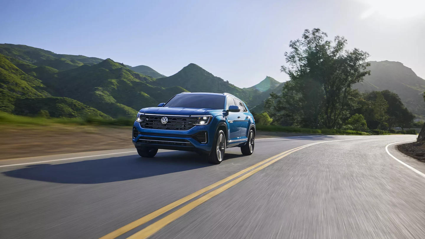 2025 VW Atlas Cross Sport MPG driving around a curve