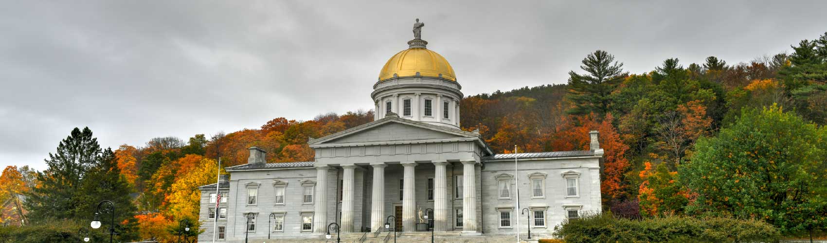 Vermont-State-House-with-Dark-Clouds-Overhead.jpg Vermont State Capitol with dramatic sky, symbolizing legal conflict