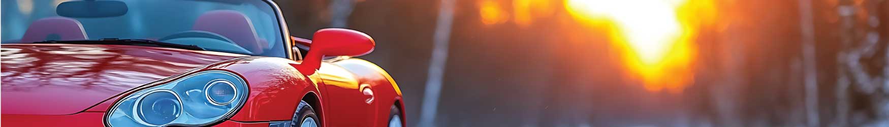 vermont-winter-convertible-savings.jpg Convertible driving in Vermont with winter woods in the background