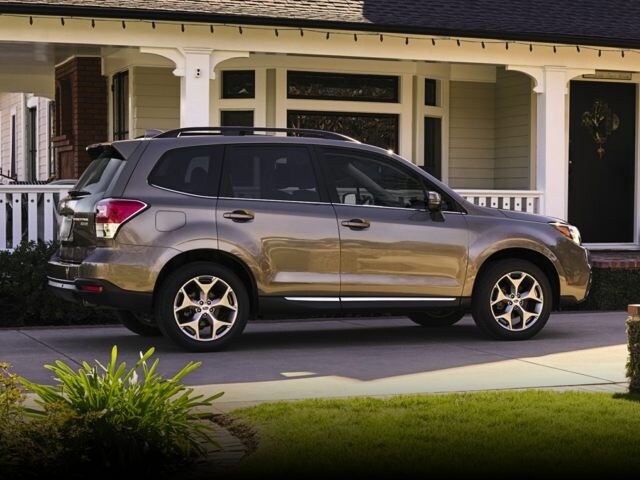 2017 Subaru Forester grey facing right in front of house with porch.jpg