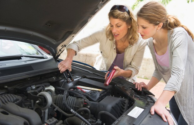 women working on car.png