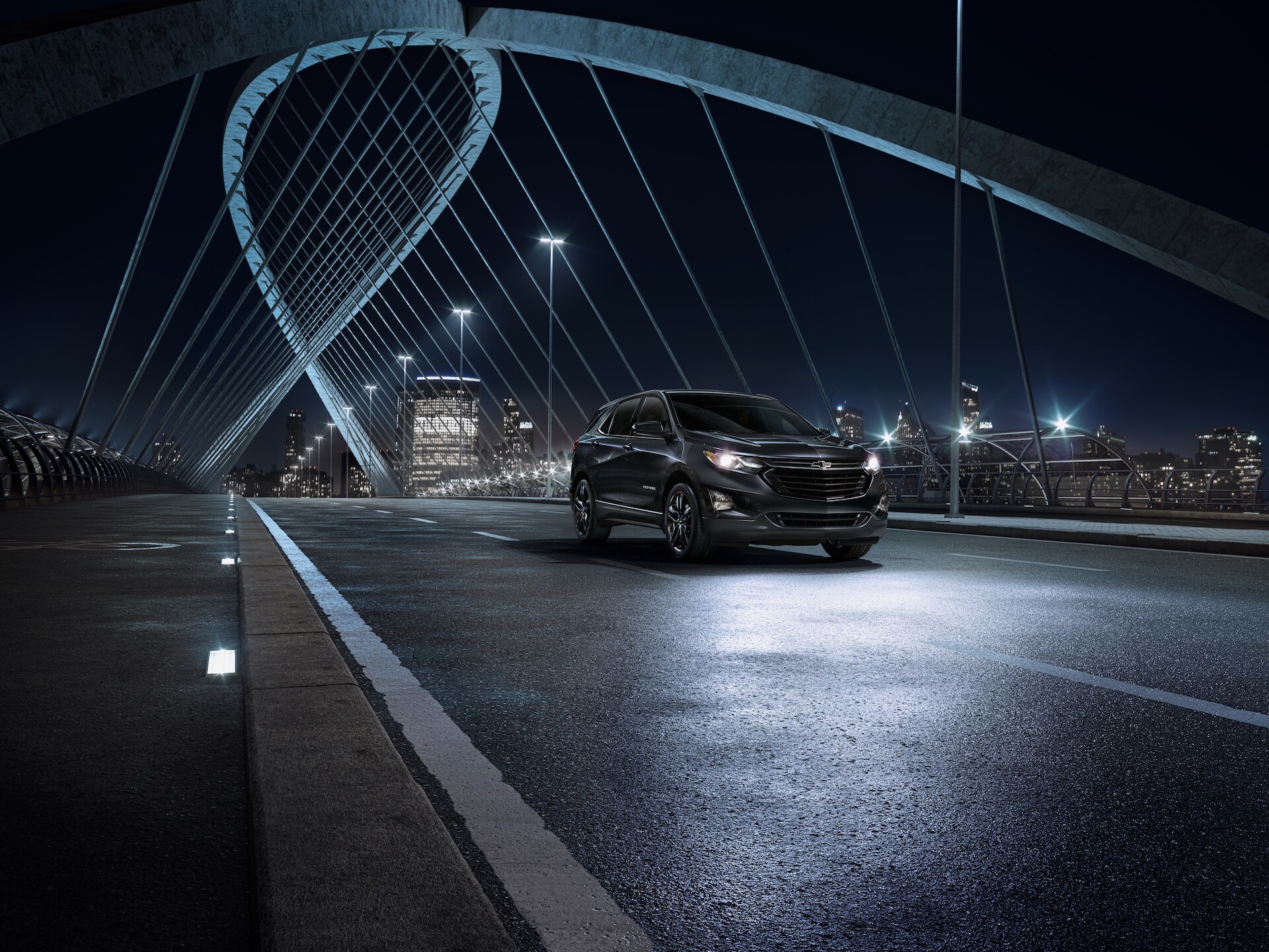Chevrolet of New Bern is a Car Dealership in New Bern near Bogue NC | 2020 Chevrolet Equinox on bridge at night