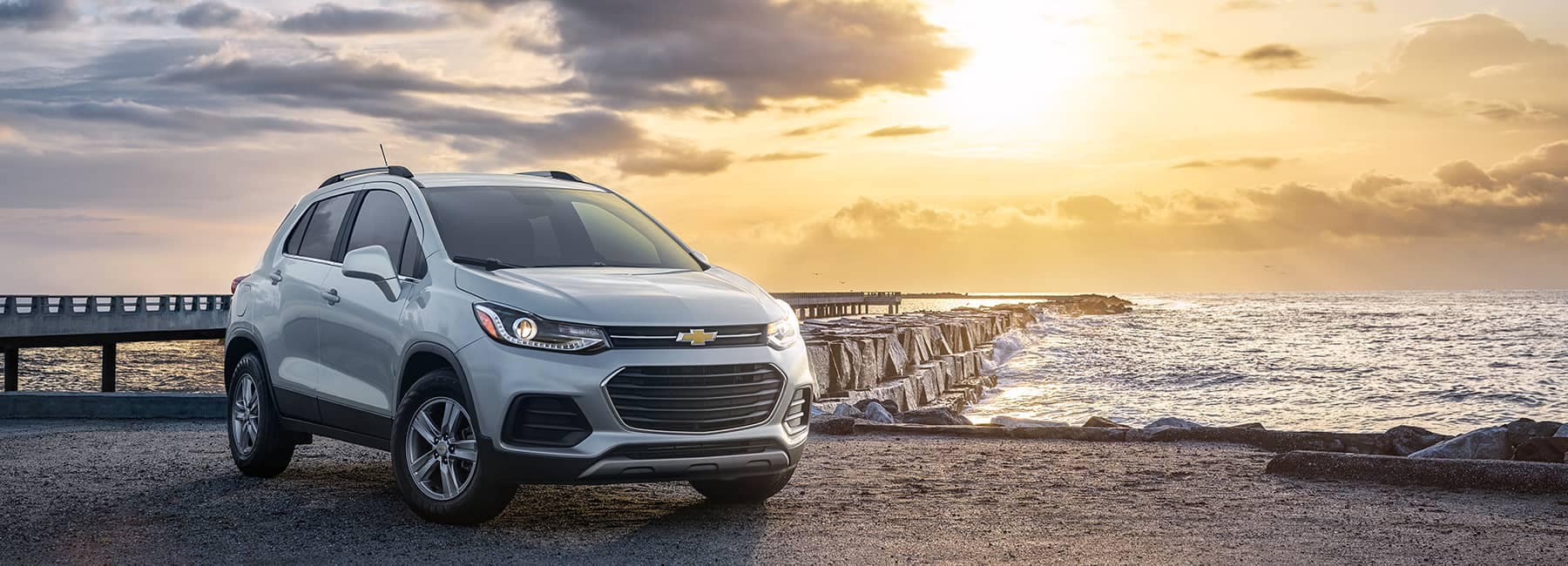 Chevrolet Trax parked in front of an ocean pier