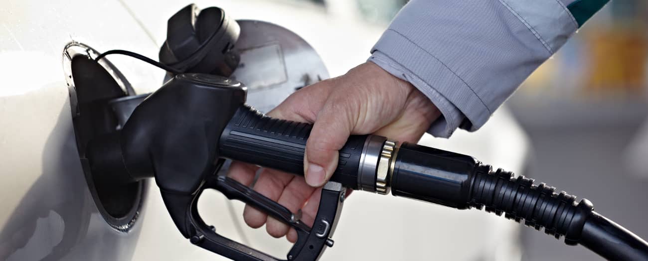 man pumping gas