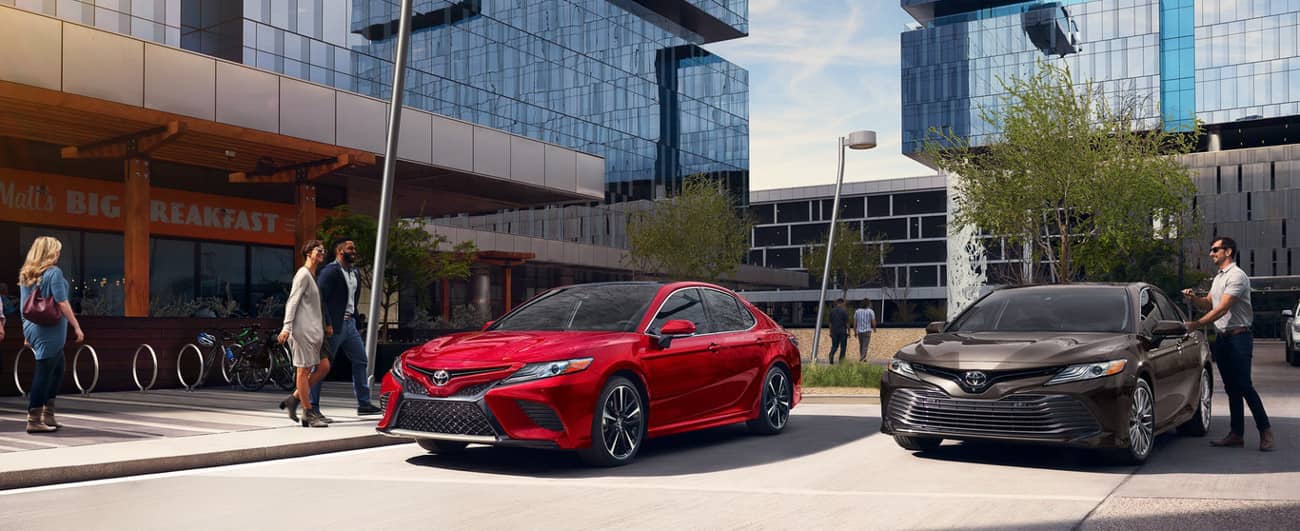 2019 Toyota Camry in Brownstone and Supersonic Red colors