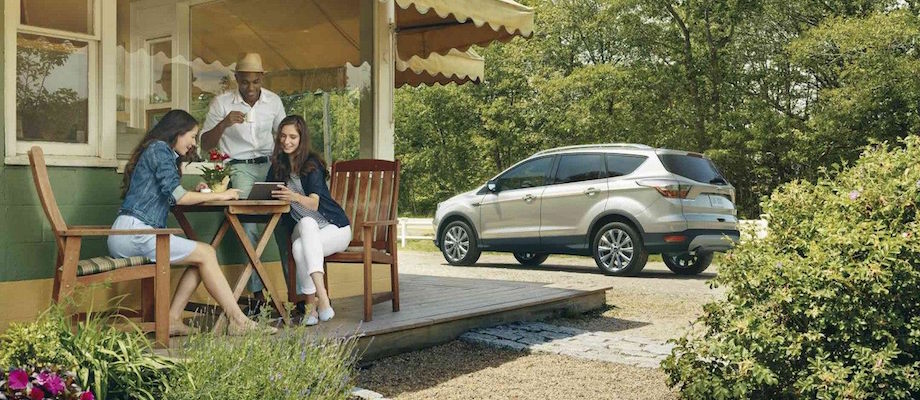 Ford Service Friends talking by thier Ford SUV