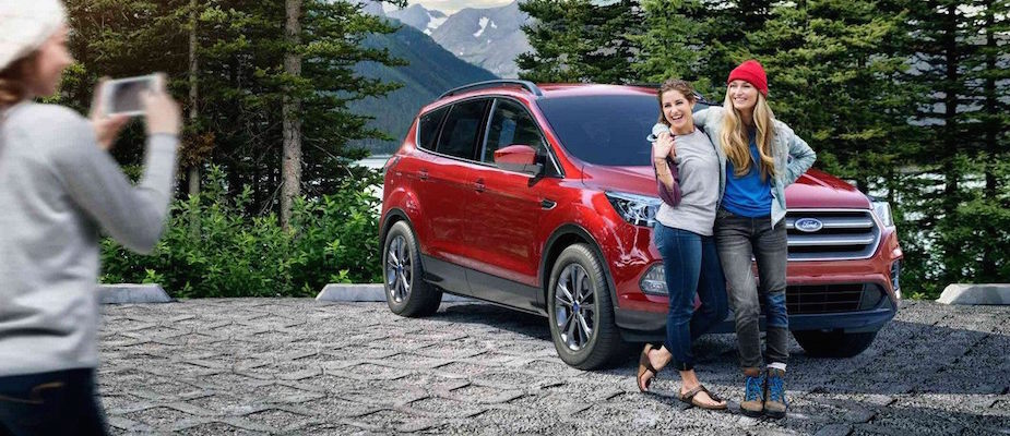 Visit Chino Hills Ford Today! A family taking pictures with their Ford vehicle