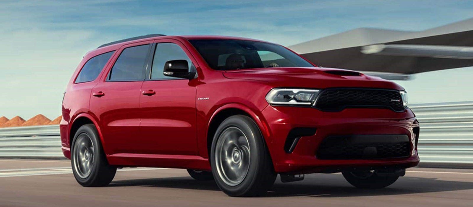 2026 Dodge Durango Trim Comparison Red 2026 Dodge Durango driving on a course