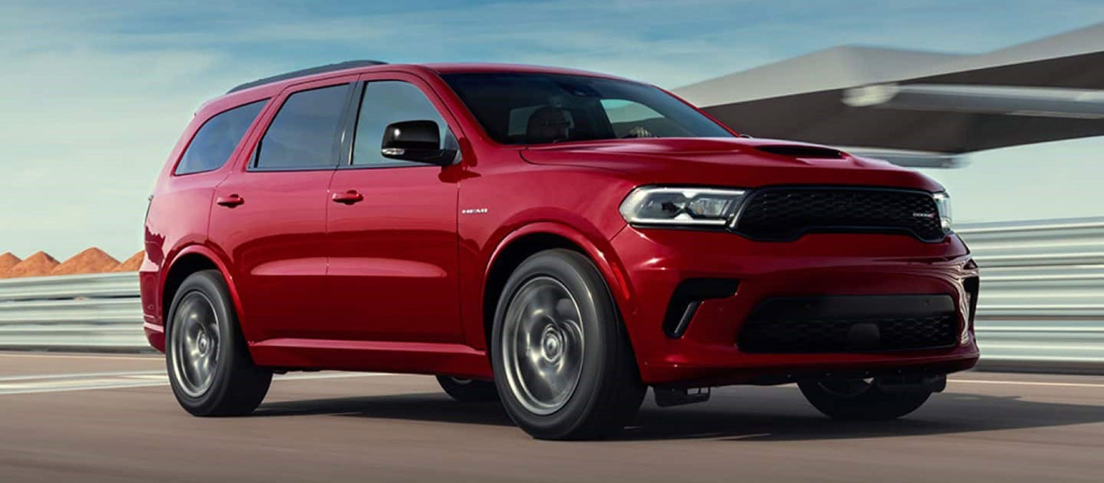 2026 Dodge Durango Trim Comparison Red 2026 Dodge Durango driving on a desert highway