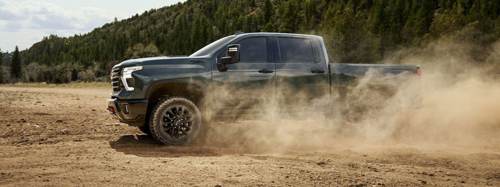 2026 Chevrolet Silverado HD Trim Comparison 2026 Chevrolet Silverado HD kicking up dust