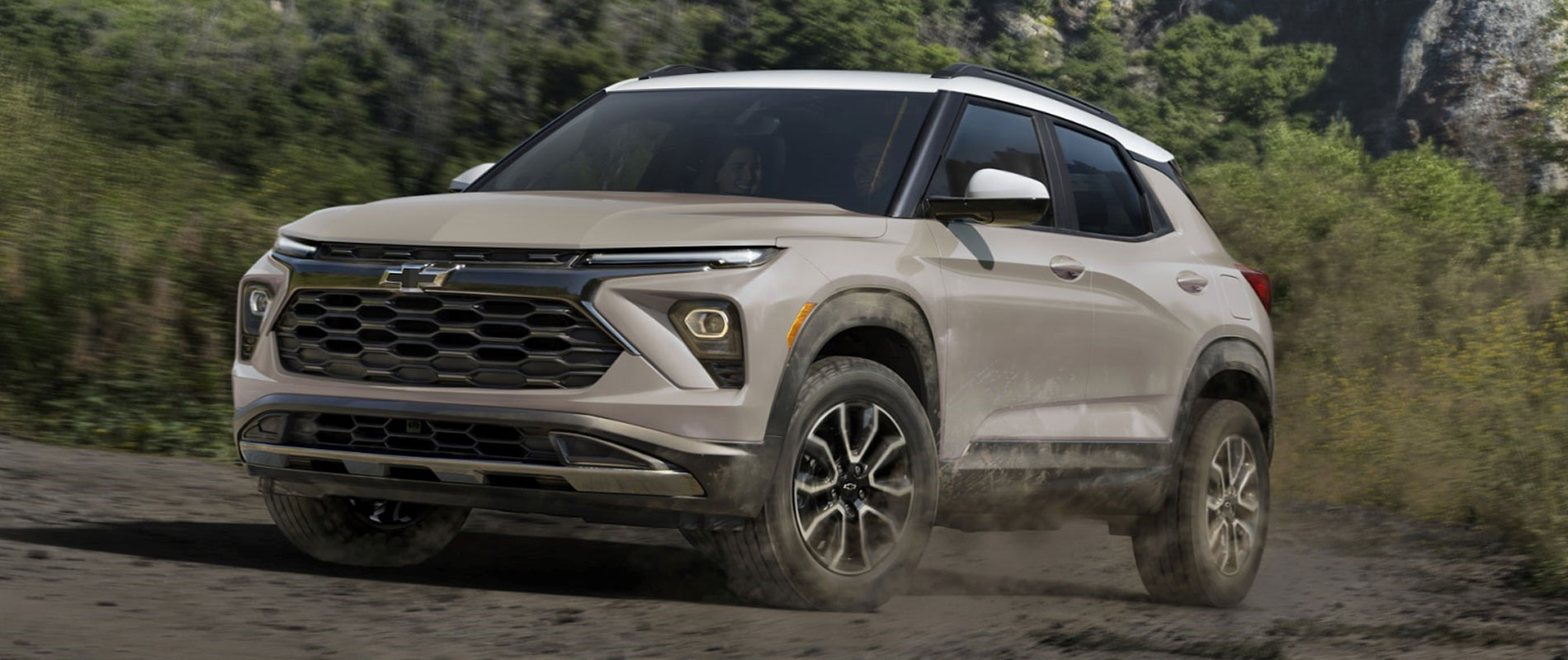 2026 Chevrolet Trailblazer Trim Comparison 2026 Chevrolet Trailblazer driving up a muddy hill