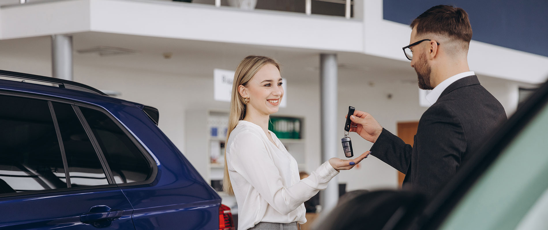 Used Car Dealership Near Elizabethtown Happy woman getting the keys to her used SUV