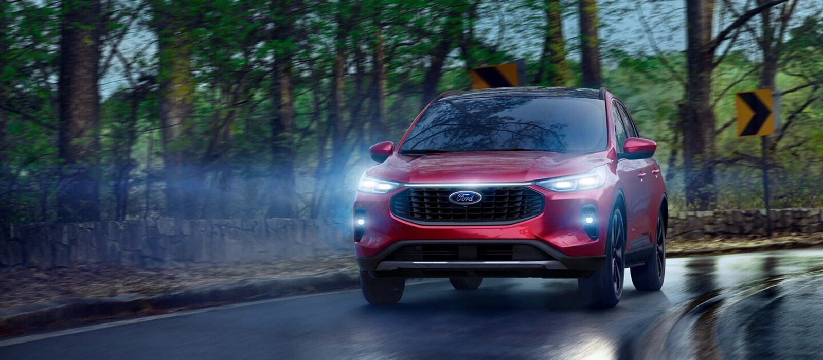 2025 Ford Escape Trim Comparison 2025 Ford Escape driving on a rain soaked road