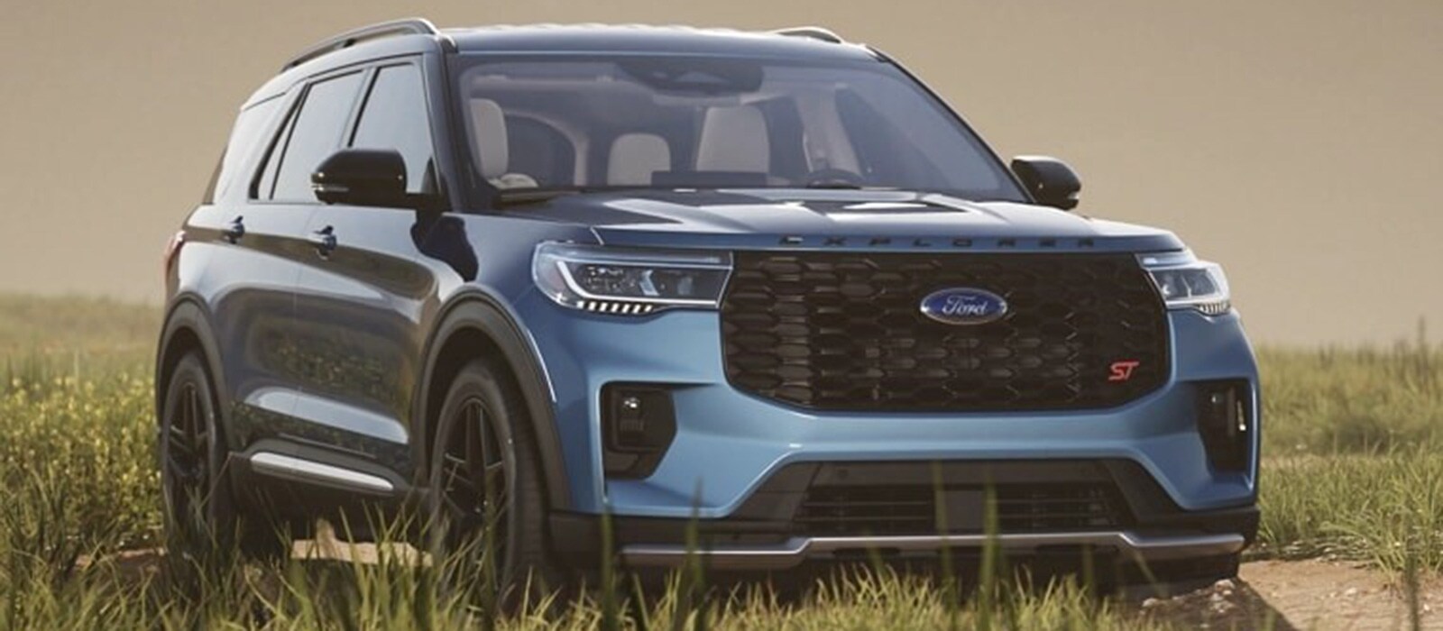 2026 Ford Explorer Trim Comparison 2026 Ford Explorer parked in tall grass