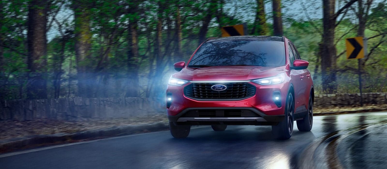 2025 Ford Escape Trim Comparison 2025 Ford Escape driving on a rain slick road
