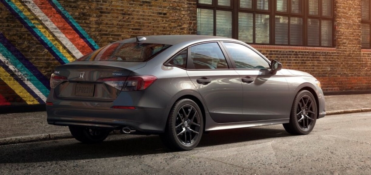 2026 Honda Civic Hybrid parked in front of a mural