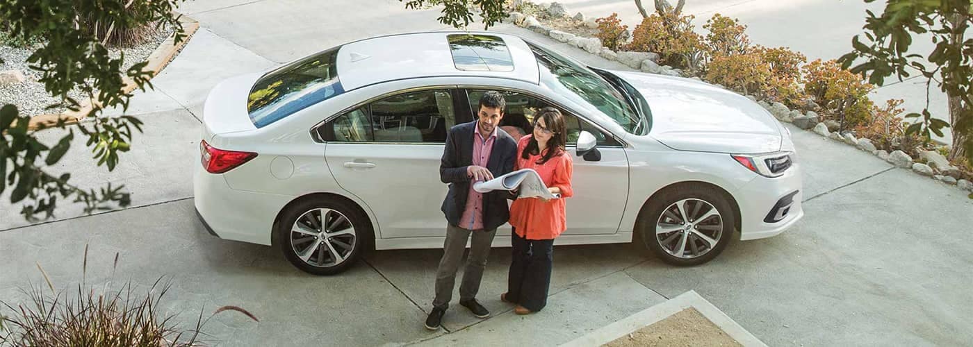 Couple-standing-next-to-a-subaru.jpg