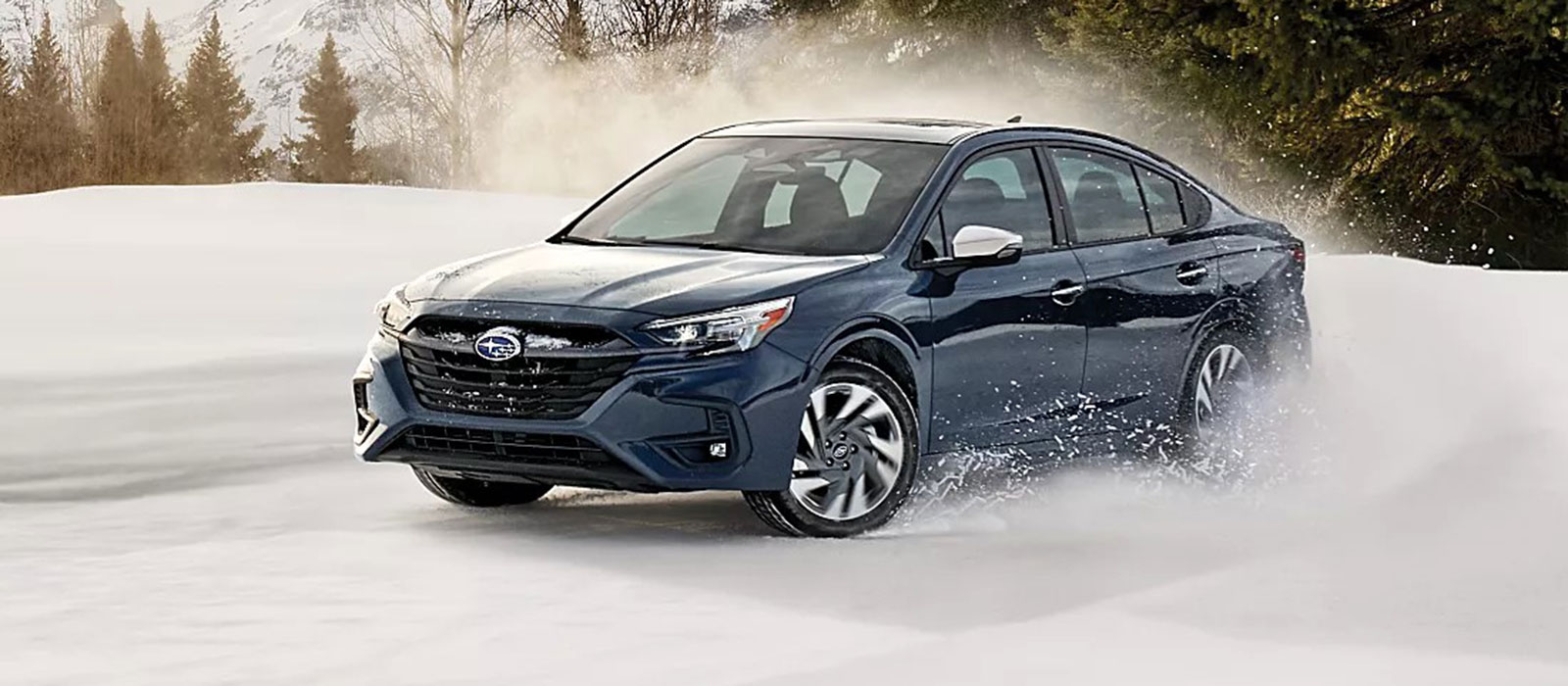 2026 Subaru Legacy Trim Comparison 2026 Subaru Legacy driving through the snow