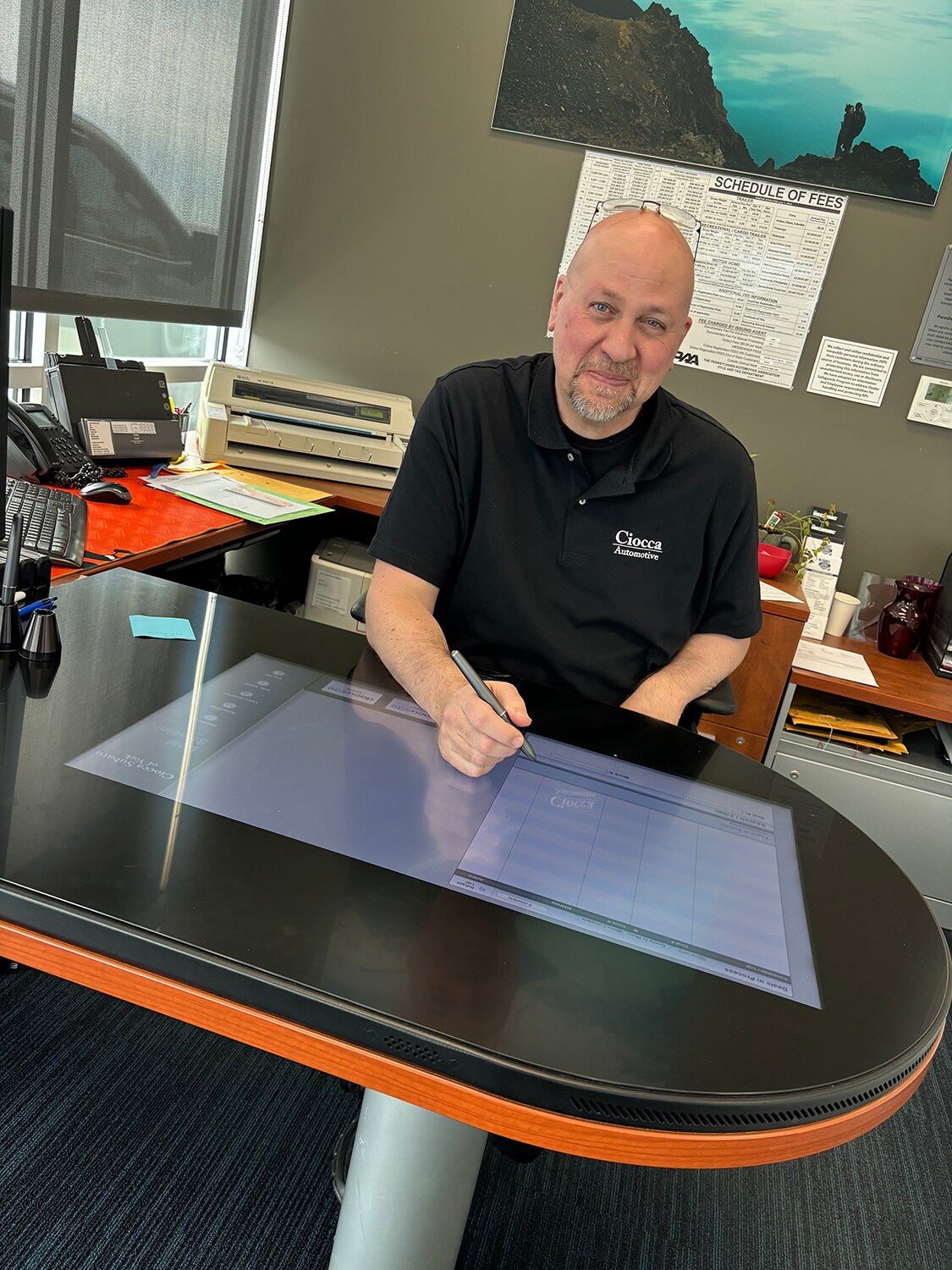 Man signing electronic lease