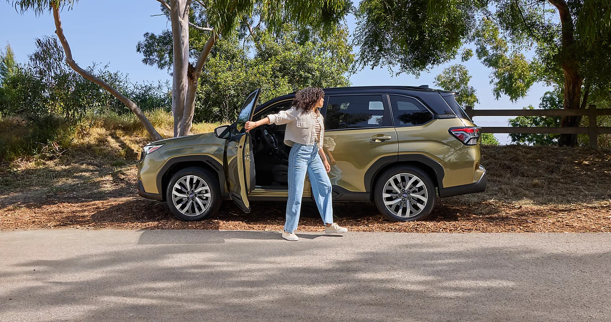 Woman walking away from a Subaru Forester after closing the driver's door