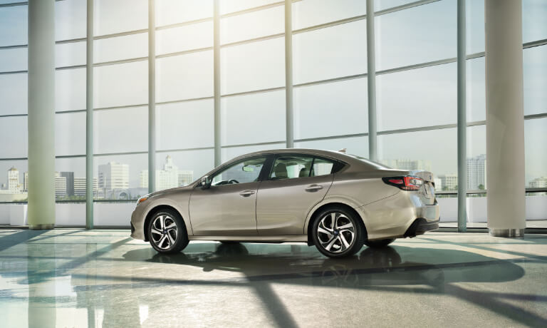 2021 Subaru Legacy next to glass wall