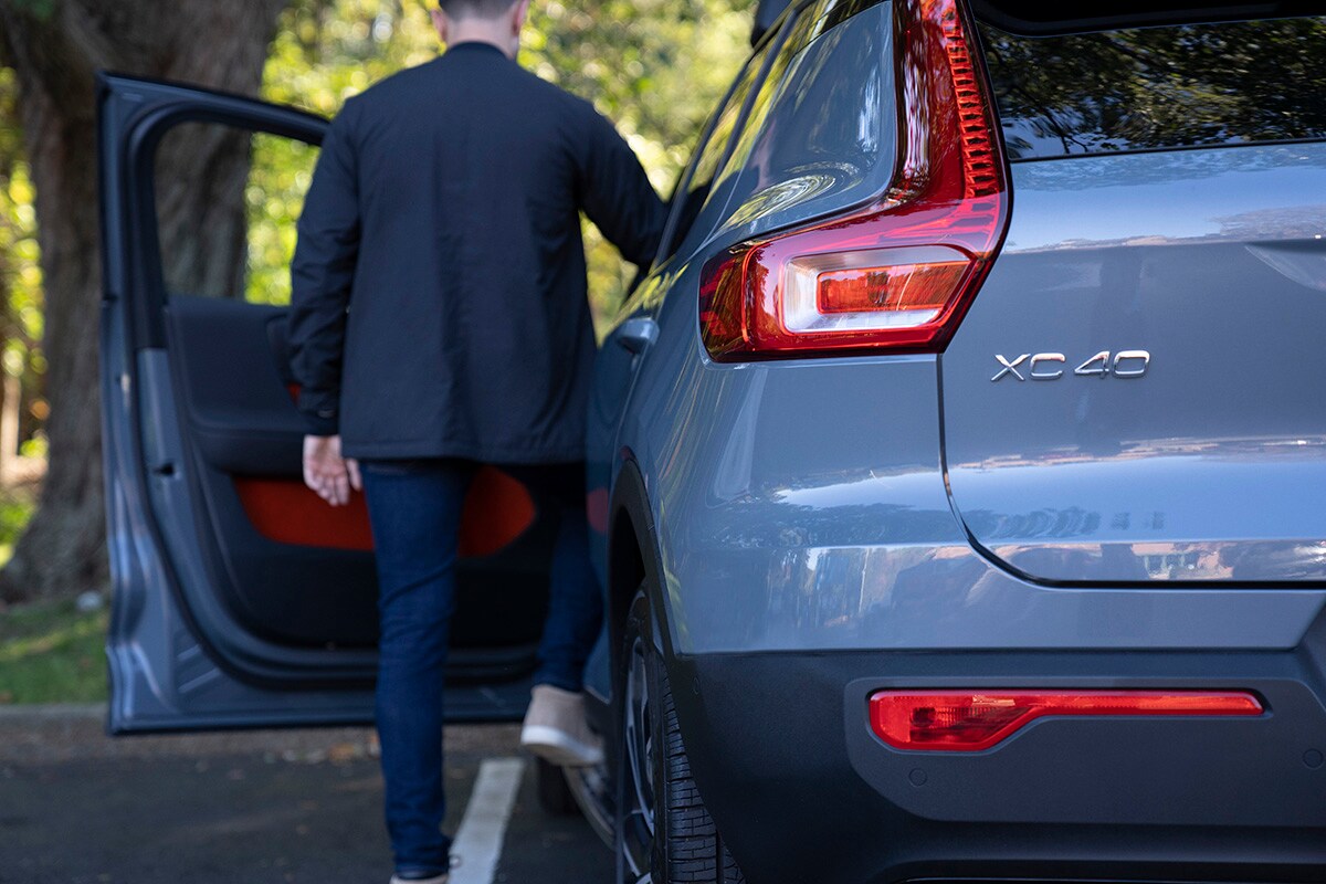 Schedule Test Drive | Accelerate My Deal Man stepping into driver's seat of a Volvo XC40