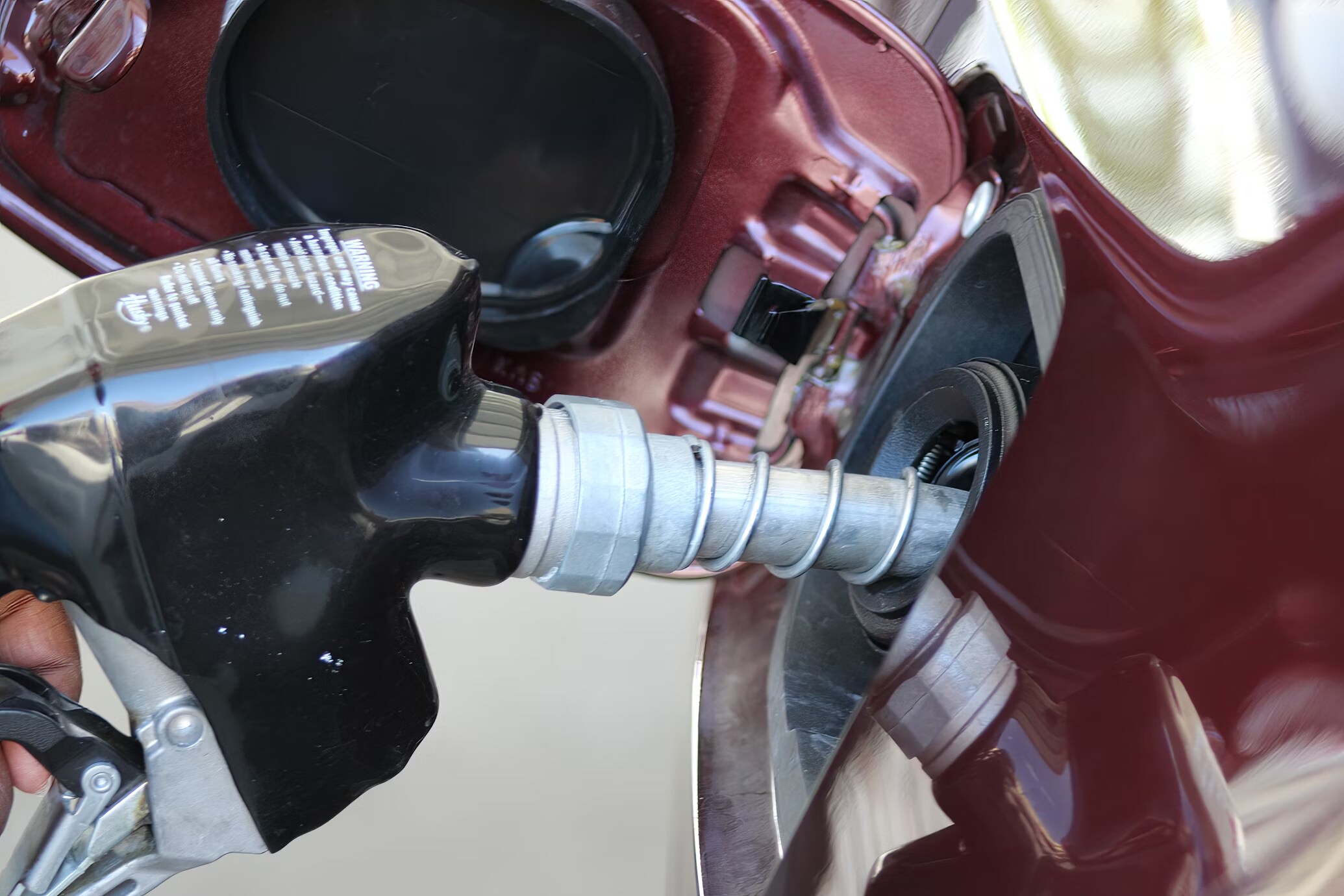 Filling up a gas tank Filling up a gas tank