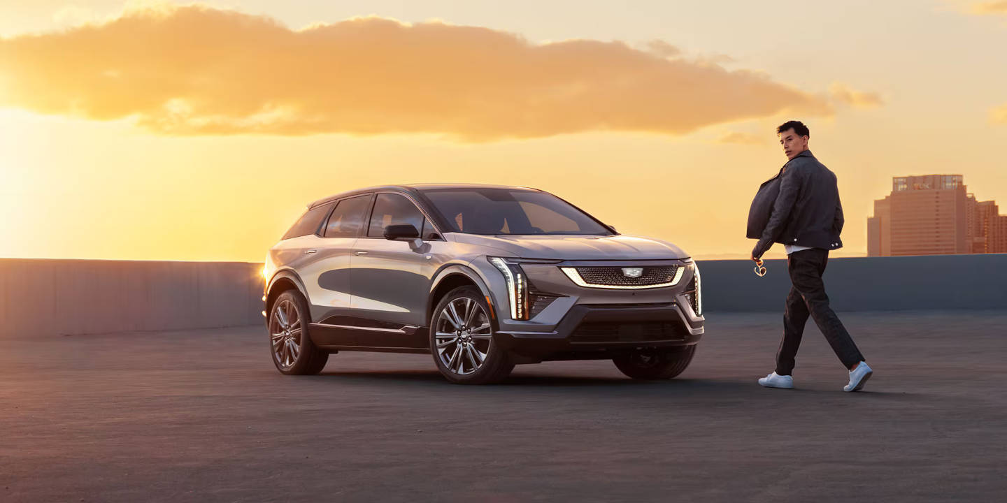 2025 Cadillac OPTIQ parked with a man walking up to it