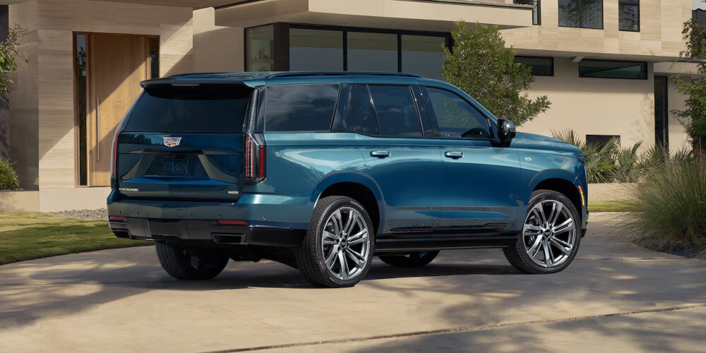 2025 Cadillac Escalade parked in a driveway side view