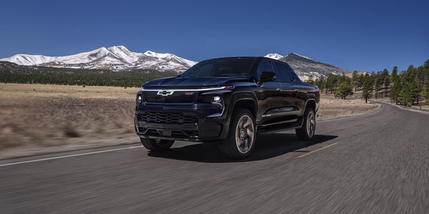 2025 Chevy Silverado EV driving through the mountains