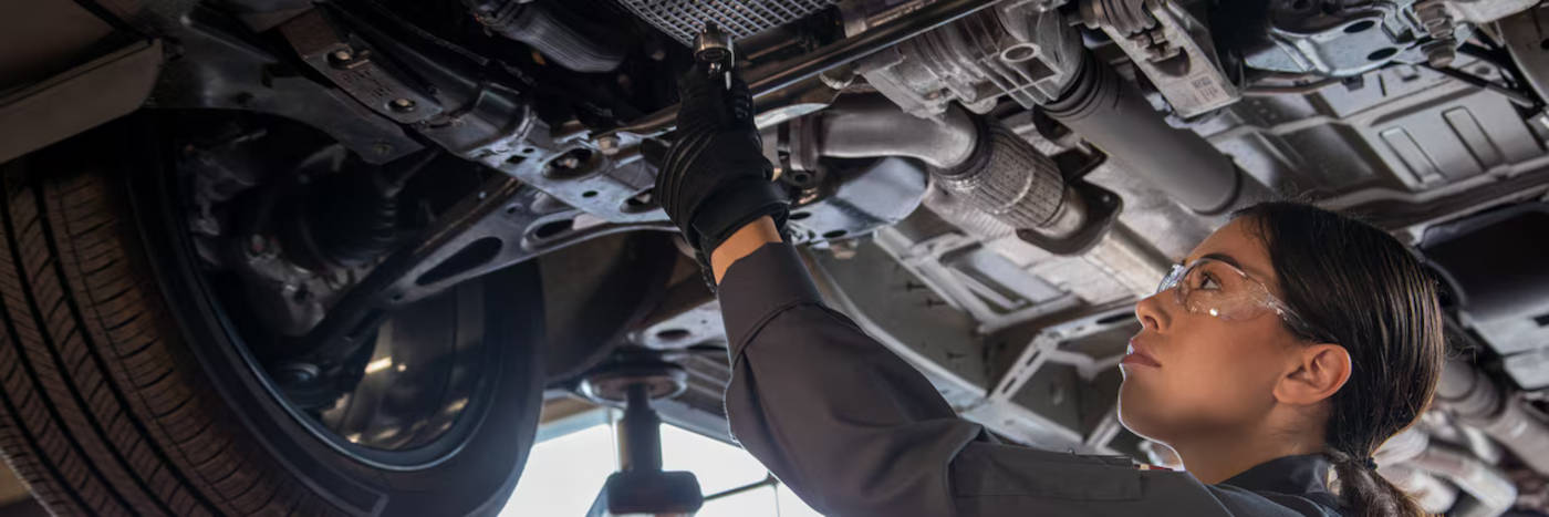 Chevy mechanic doing an oil filter change