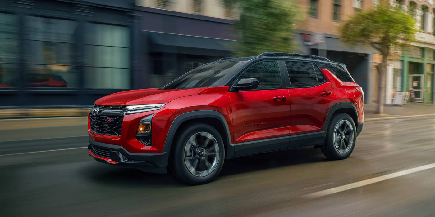 2025-equinox-rs.jpg 2025 Chevy Equinox RS driving through the city