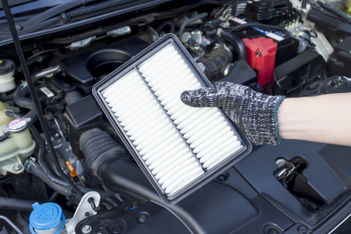 Mechanic servicing cabin air filter